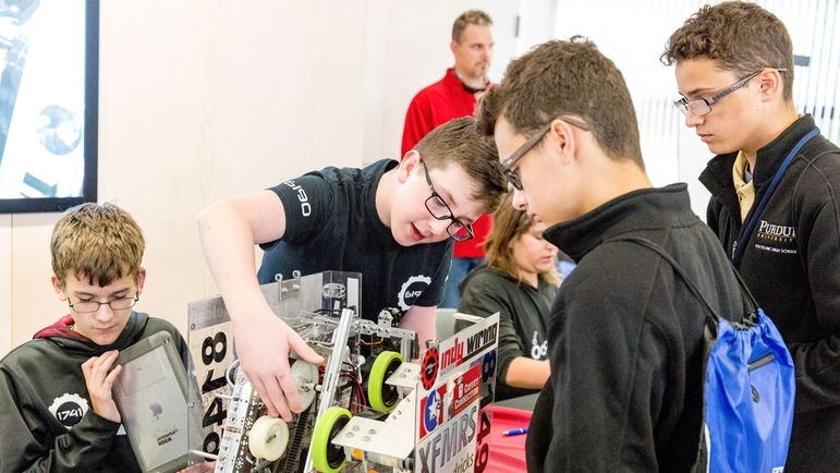 Robotics teams teach other students about their robot
