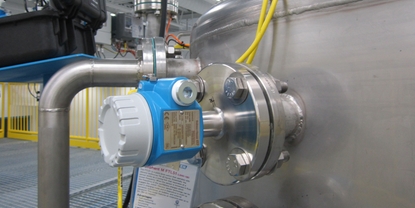 A level switch, located near the top of a tank, detects possible overflow conditions.