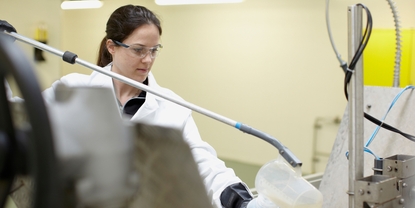 Technician takes grab sample for comparison in the lab.